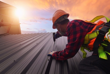man on metal roof